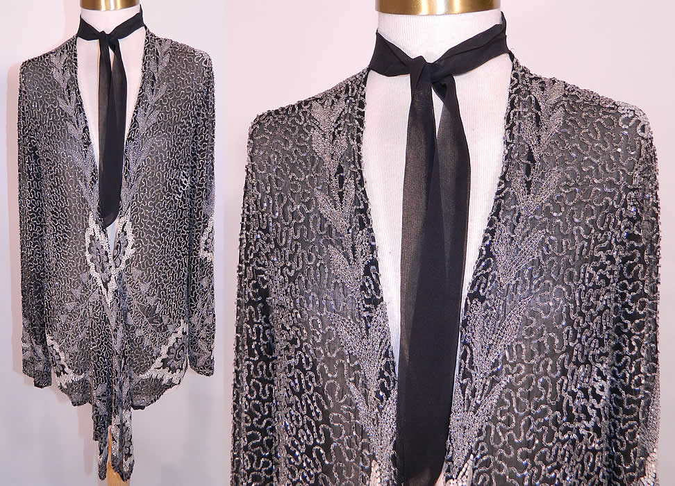 Vintage Art Deco Black Silk Chiffon White Beaded Flapper Evening Coat Jacket. It is made of a black sheer silk chiffon fabric, covered with hand sewn white, silver crystal beading done in an Art Deco scrolling, spiral, floral pattern design. 