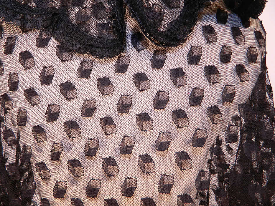 Victorian Antique Black Net Lace Square Cube Blouse Coat Jacket. It is sheer and unlined. The jacket measures 20 inches long, with a 34 inch waist, 40 inch bust, 14 inch back and 25 inch long sleeves.