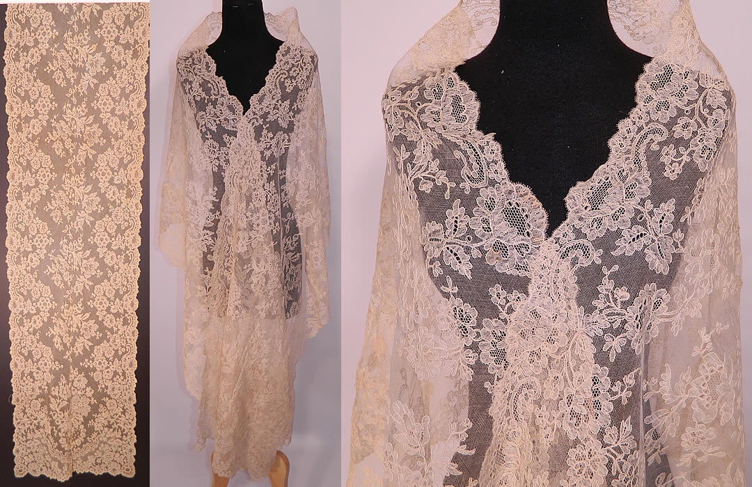 Victorian Antique Blonde Chantilly Bobbin Lace Mantilla Spanish Shawl Veil. It is made of a sheer fine off white cream color blonde net French chantilly lace, with a floral foliage pattern outlined in raised cordonnet threads with detailed shading effects and a beautiful decorative scalloped border edging.