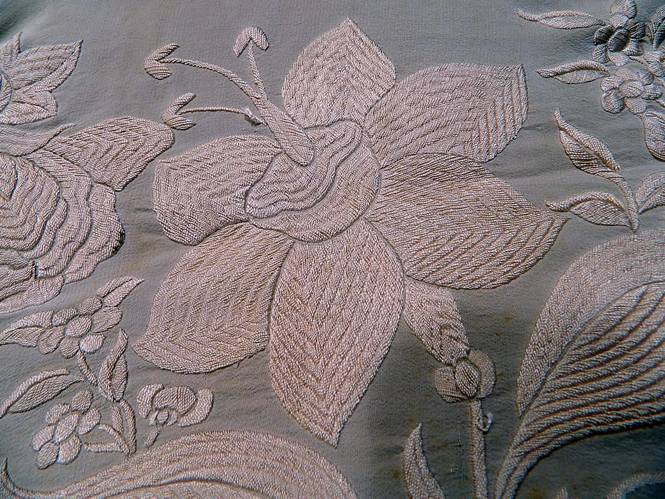 Antique Cream White Silk Embroidered Floral Canton Wedding Piano Shawl. There is a fabulous fine untangled hand knotted macram&eacute; off white cream color silk fringe which measures 9 inches long surrounding the entire shawl with rounded corners.