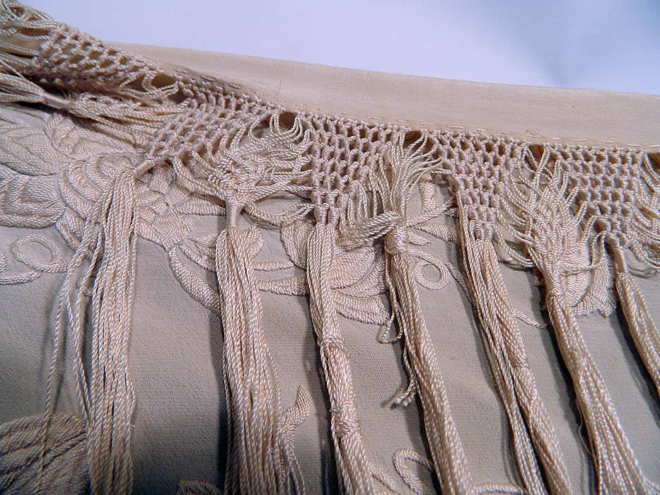 Antique Cream White Silk Embroidered Floral Canton Wedding Piano Shawl. It is in good condition, with only a few small faint age spots stains. This is truly a rare and wonderful piece of wearable textile art! 