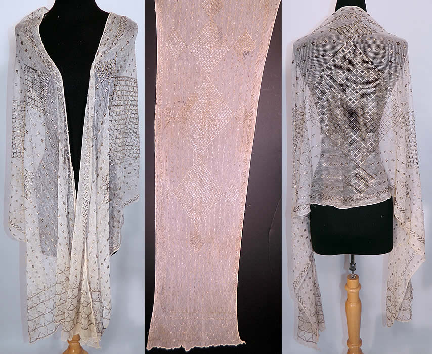 Vintage Art Deco Egyptian Assuit White Net Diamond Design Silver Shawl Scarf. This antique Art Deco Egyptian Assuit white net diamond design silver shawl scarf dates from the 1920s. It is made of a sheer off white cotton netting, covered with thousands of hand applied silver metal pieces done in a decorative Art Deco abstract geometric diamond design pattern. 