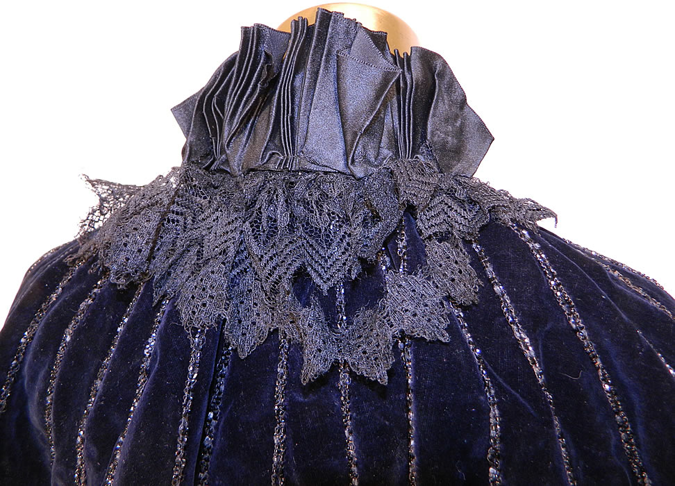 Victorian Black Velvet Jet Beaded Evening Opera Cloak Cape Capelet. It is in good condition, but does have some splits fraying of the silk ribbon tie trim on front and black lace collar on back 