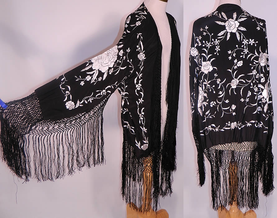 Vintage Black & White Silk Floral Embroidered Piano Shawl Fringe Robe Coat. This vintage black and white silk floral embroidered piano shawl fringe robe coat dates from the 1920s. It is made of black silk fabric, with a white silk raised padded satin stitch embroidered floral vine leaf design created from an antique piano shawl. 