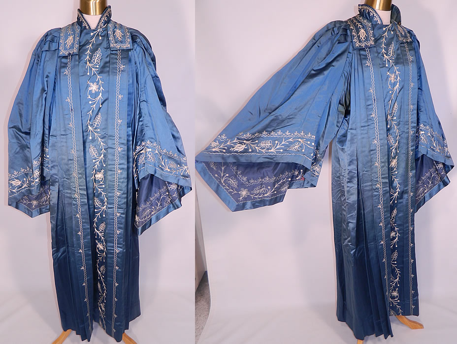 Vintage Henderson Ames Co Regalia Blue Silk Ceremonial Robe Gown. It is made of a cornflower blue color silk satin fabric, with decorative white stitching embroidery work done in a floral vine leaf design.