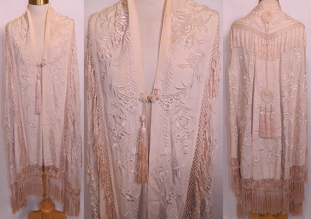 Antique Cream Silk Embroidered Tassel Wedding Shawl Cloak Cape. This antique Edwardian era cream silk embroidered tassel wedding shawl cloak cape dates from 1910. It is made of an off white cream color fine silk fabric, with raised padded satin stitch, french knot, eyelet hand embroidery work. 