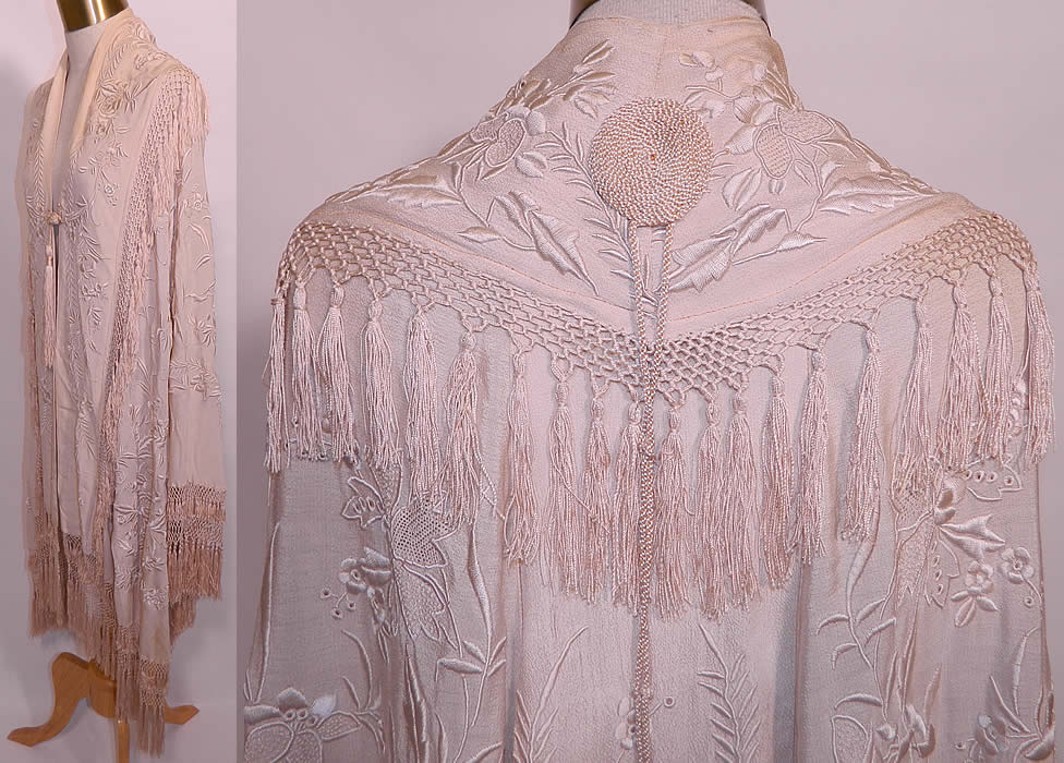 Antique Cream Silk Embroidered Tassel Wedding Shawl Cloak Cape. There are embroidered floral vine leaf designs. This beautiful bridal wedding cloak cape was custom made and created from an antique Spanish Flamenco style piano shawl, with hand knotted macram&eacute; cream color silk fringe trim edging and a back shawl collar.