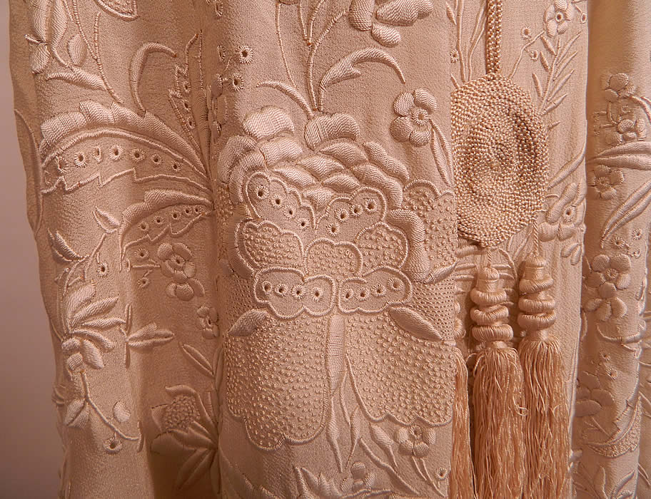 Antique Cream Silk Embroidered Tassel Wedding Shawl Cloak Cape. The cape measures 40 inches long, with a 56 inch bust and 142 inch bottom circumference.