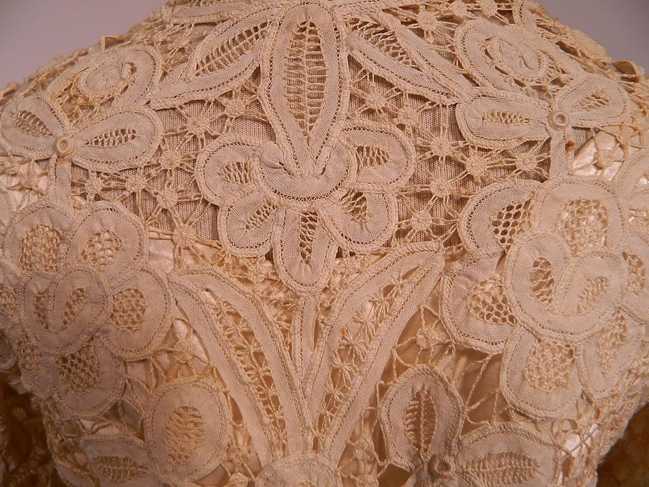 Edwardian Antique Battenburg Crochet Tape Lace Wedding Gown Dress. The skirt measures 40 inches long in the front, 45 inches long in the back, with a 34 inch waist.