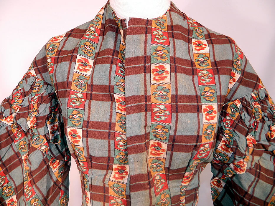 Victorian Civil War Floral Paisley Plaid Print Wool Challis  Hoop Skirt Dress. This beautiful dress has long layered tiered full sleeves with a flared bell shape pagoda oversleeve, smocking gathers around the top and fitted cuffs, a long full hoop skirt with inside pocket, fully lined in a brown cotton fabric and hidden hook closures down the front.
