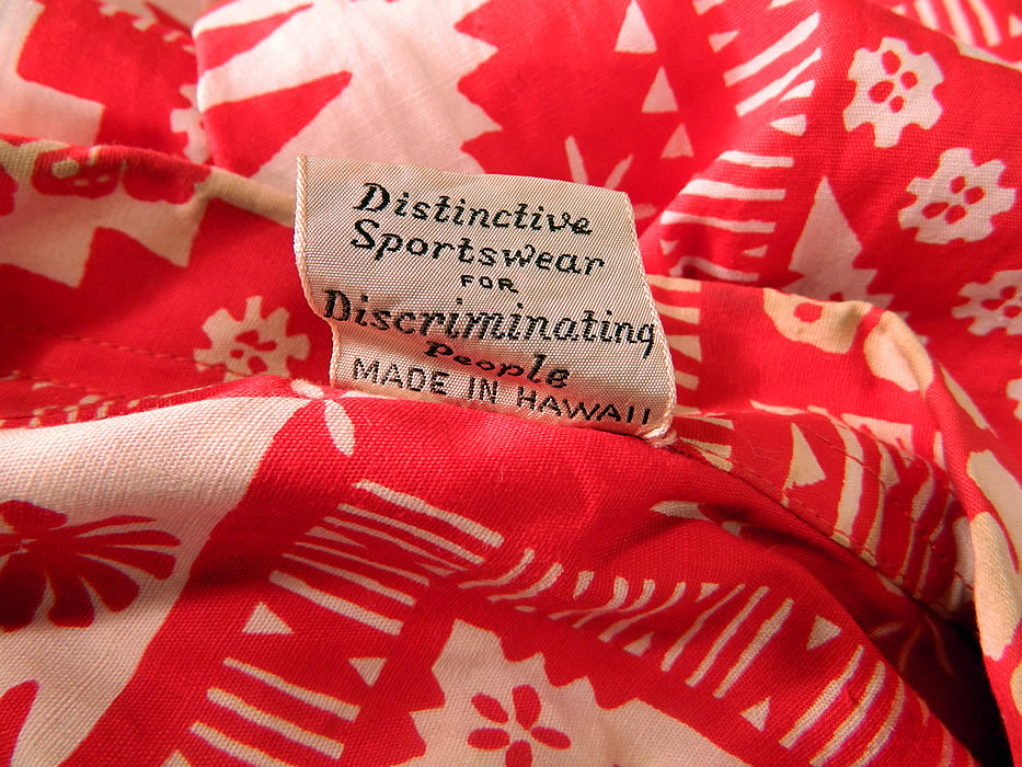 Vintage Alfred Shaheen Hawaiian  Hibiscus Print Cotton Aloha  Shirt & Red Pants. There is a "Made by Shaheen's of Honolulu Distinctive Sportswear for Discriminating People Made in Hawaii" label and size Medium tag sewn inside. 