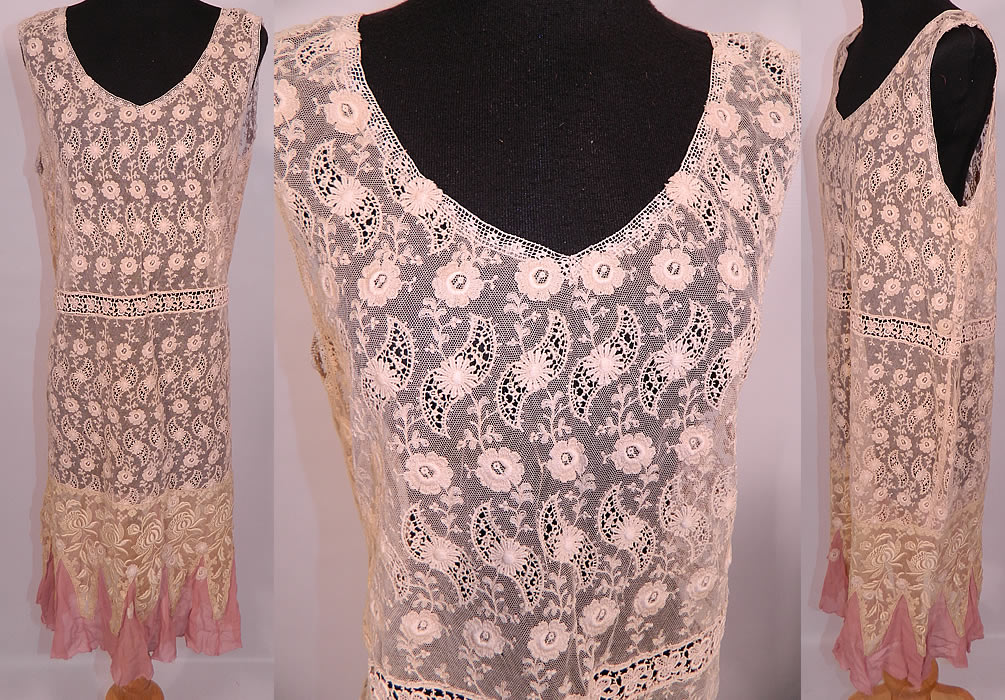 Vintage Cream  Embroidered Net Lace Drop Waist Pink Silk Hem Chemise Dress. This exquisite vintage cream embroidered net lace drop waist pink silk hem chemise dress dates from the 1920s. It is made of an off white cream color cotton net fabric, with raised padded satin stitch and French knot embroidery work done in a floral vine leaf design, with lace inserts. This lovely lace drop waist dress is loose fitting, with a chemise straight shift style, sleeveless, with a V front neckline, pink silk chiffon trimmed handkerchief hemline skirt and is sheer, unlined. 