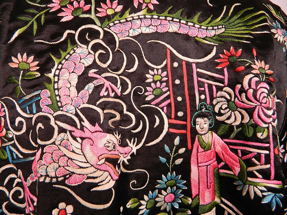 Vintage Chinese Dragon & Phoenix Peking Knot Silk Embroidered Figural Jacket. This exquisitely embroidered quality made jacket has a loose fitting boxy style, with long full sleeves, mandarin collar, front pockets, fully lined, with silk button toggle closures and an added zipper front closure.