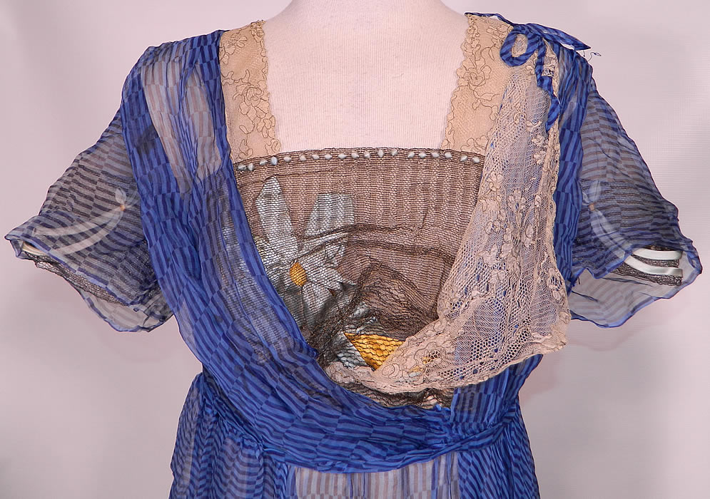 Edwardian Titanic Blue Black Stripe Silk Chiffon Gold Lace  Gown Hosac Chicago Paris Label. This beautiful blue dress has a long tea length skirt, a layered style, with a gathered drape skirt, short sleeves, bow trim shoulder, blue velvet ribbon bow back trim, snap closures on the back and is fully lined in an off white cream color silk fabric. 