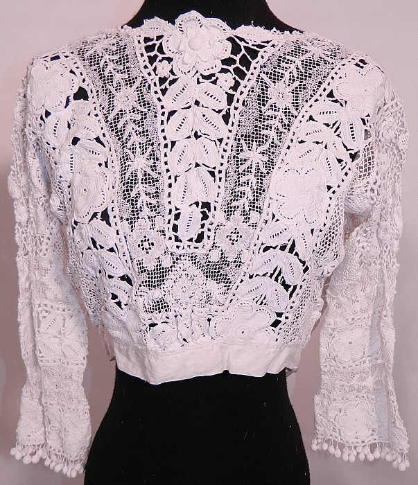 Edwardian Antique White Irish Crochet Tape Lace Bodice Blouse. This Edwardian era antique white Irish crochet tape lace bodice blouse dates from 1910. It is made of a white sheer Irish crochet tape lace with connecting thread picot ornamented bars, crochet ball fringe trim, filet lace and embroidered net inserts. 