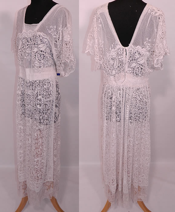 Edwardian White  Net Embroidered Soutache Crochet Filet Lace Dress. There are crochet filet lace and drawn cut work detail accents. This lovely lace dress is a long tea length, with a layered squared neckline, flared dolman style short sleeves, a fitted waistband and is fully lined in a white cotton sheer net fabric with hook closures on the back. 
