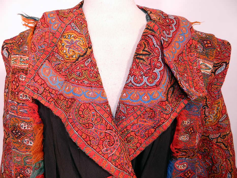 Antique Kashmir Hand Embroidered Woven Wool Pieced Paisley Long Duster Coat. It is made of colorful soft Kashmir wool hand embroidered and pieced together  in a paisley pine cone shaped tear drop motif  boteh and decorative floral leaf designs. The coat was custom made and created from an early 19th century Kashmir paisley shawl, with wonderful workmanship and design.