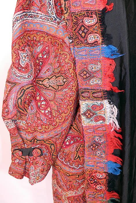 Antique Kashmir Hand Embroidered Woven Wool Pieced Paisley Long Duster Coat. The coat measures 49 inches long, with 52 inch hips, a 52 inch waist, 52 inch bust, a 18 inch back and 26 inch long sleeves. It is in excellent condition.