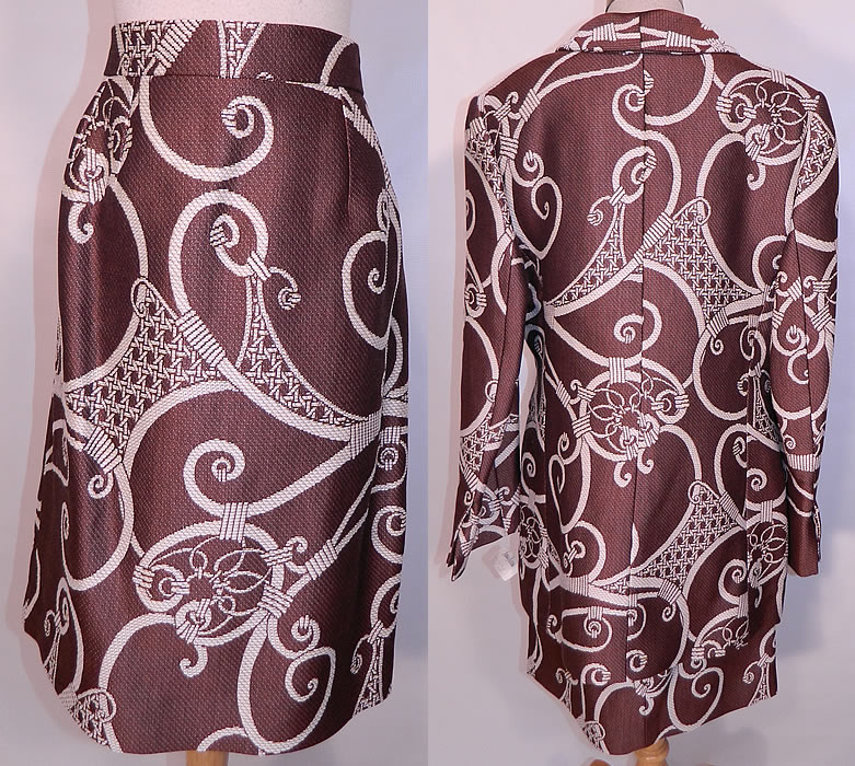 Vintage Christian Dior Boutique Brown & White Brocade Suit Jacket & Skirt. This beautiful designer two piece suit has a long loose fitting boxy suit jacket, with a scalloped wide lapel collar, shoulder padding, long full sleeves, white woven silk covered buttons for closure down the front and is fully lined in a brown silk fabric.