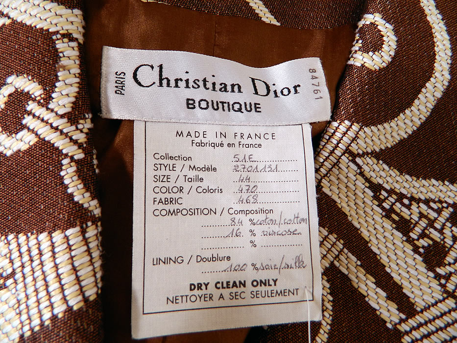 Vintage Christian Dior Boutique Brown & White Brocade Suit Jacket & Skirt. There is a matching fabric  skirt, with back zipper button closure and is fully lined with same designer label sewn inside. The skirt measures 23 inches long, with 38 inch hips and a 28 inch waist. 