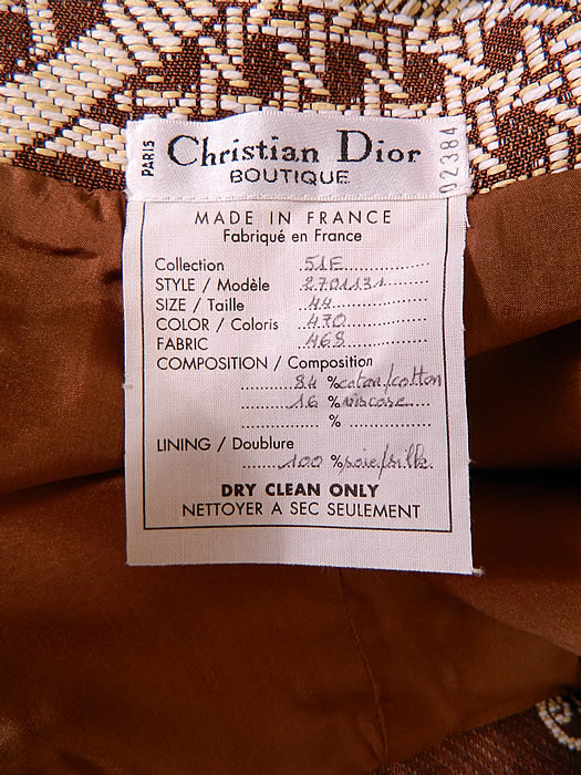 Vintage Christian Dior Boutique Brown & White Brocade Suit Jacket & Skirt. There is a "Christian Dior Boutique Paris Made in France" identification numbered designer label European size 44, US size 12 tag sewn inside.