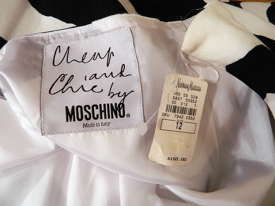 Vintage Cheap & Chic Moschino Black & White Zebra Print Suit Jacket Skirt. There is a "Cheap and Chic by Moschino Made in Italy" designer label, US size 12 tag sewn inside. The jacket measures 30 inches long, with 38 inch hips, a 34 inch waist, 40 inch bust and 25 inch long sleeves. 