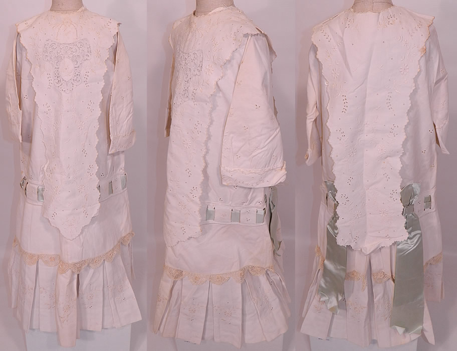 Edwardian White Cotton Pique Eyelet Embroidered Lace Childs Dress  & Dickey Collar. This exquisite antique Edwardian era white cotton pique eyelet embroidered lace childs dress and dickey collar dates from 1910. It is made of a white cotton pique ribbed textured fabric, with raised padded satin stitch embroidery work, eyelet cut work and a Point de Venise lace trim front panel insert all done in a floral leaf design pattern. 