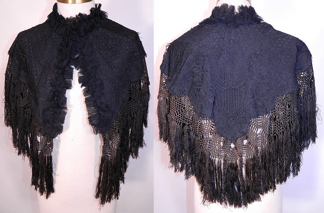 Victorian Black Silk Lace Fringed Mourning Cropped Cloak Cape Capelet. This antique Victorian era black silk lace fringed mourning cropped cloak cape capelet dates from 1880. It is made of a black silk fabric lining backing, with sheer a black silk lace overlay and black silk hand knotted macrame fringe trim.