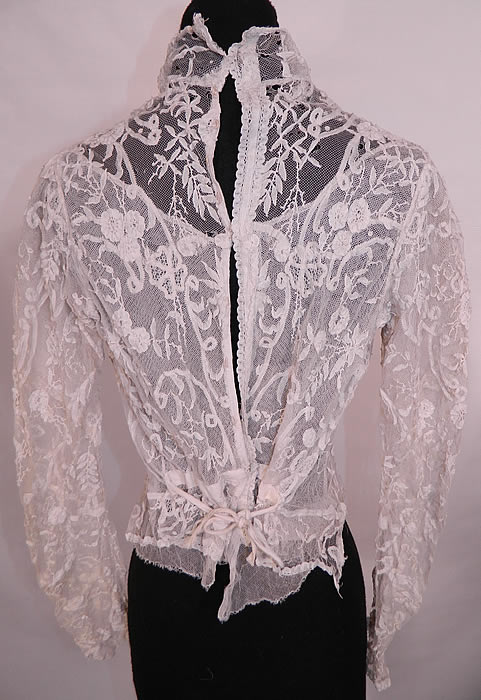 Victorian Princess  Brussels Bobbin Tape Lace White Net Shirt Blouse. This lovely lace beautiful blouse has a high collar neckline,  long sleeves, a  skirt bottom with tie back, is lined in a sheer white net and has hook closures down the back.