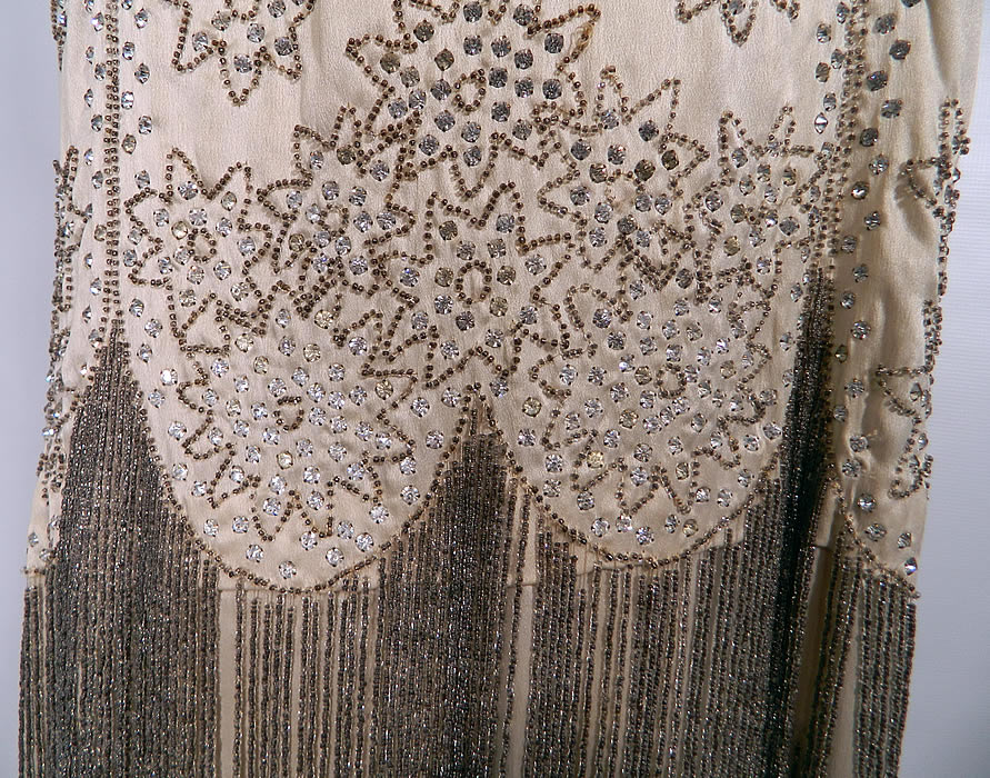 Vintage White Silk Rhinestone Silver Beaded Fringe Flapper Drop Waist Dress. The rest of the dress is in good condition. It would be great for design, restoration or remade. This is truly an amazing piece of wearable Art Deco beaded textile art! 