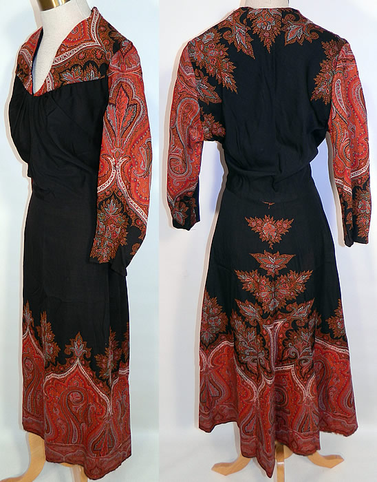 Vintage Red Orange Paisley Shawl Black Wool Dress. This stunning shawl was beautifully custom made into a women's dress, with wonderful workmanship and pieced detailing. The dress has a V front neckline, pleated gathered front top, long sleeves, a full skirt, side zipper closure and is unlined. 