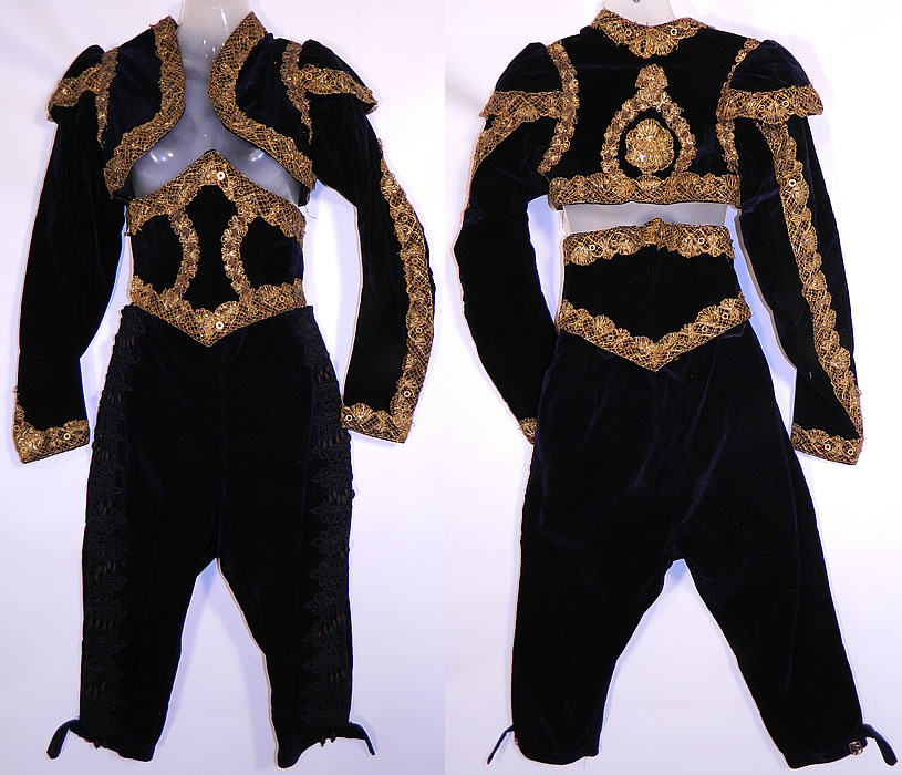 Vintage Spanish Matador Bullfighter Bolero Jacket Knickers Waist Cincher Costume. This antique Spanish matador bullfighter bolero jacket, knickers, waist cincher three piece costume dates from 1900. It is made of a black velvet fabric, with gold metallic lace sequin trim and black lace applique, silk ball fringe trim on the pants.