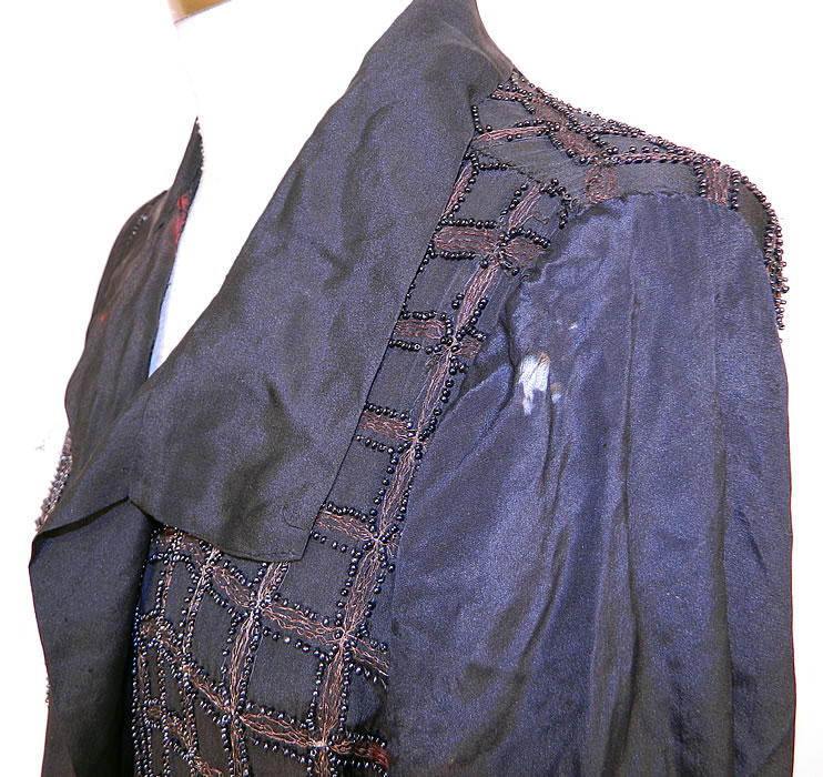 Vintage Art Deco Black Silk Gold Lam&eacute; Beaded Grid Evening Flapper Coat Jacket. It is in as-is fair condition, with  some staining, tarnish discoloration under the arms and in areas, with several tiny pin holes scattered throughout and a few small frayed holes on the shoulder (see close-up). This is truly a wonderful piece of wearable Art Deco textile art which would be great for design! 