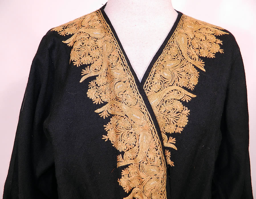 Vintage Paisley Chain Stitch Crewel Work Embroidery Black Wool Belted Robe Coat. The elaborate design work is embroidered along the border edging, sleeve cuffs, pockets and belt. This beautiful boho robe coat is a long floor length, with a loose fitting style, belted tie sash, long full sleeves, front pockets, open front with no closure and is fully lined. 