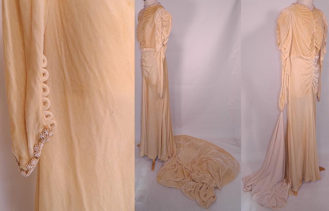 Vintage Pearl Beaded Cream Silk Velvet Bias Cut  Wedding Gown Dress Long Train Skirt. The dress measures 65 inches long in the front, with an additional 70 inch long train on back, 38 inch hips, a 30 inch waist, 36 inch bust and 29 inch long sleeves.