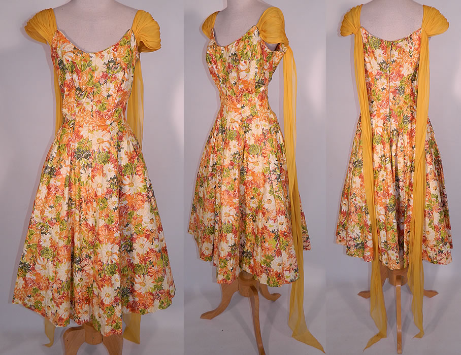 Vintage Edson's Hotel Syracuse Yellow Chiffon Scarf Floral Print Cotton Circle Skirt Dress. This vintage Edson's Hotel Syracuse yellow chiffon scarf floral print cotton circle skirt dress dates from the 1950s. It is made of a colorful cotton fabric, with shades of orange, red, yellow, green done in an abstract floral print design.