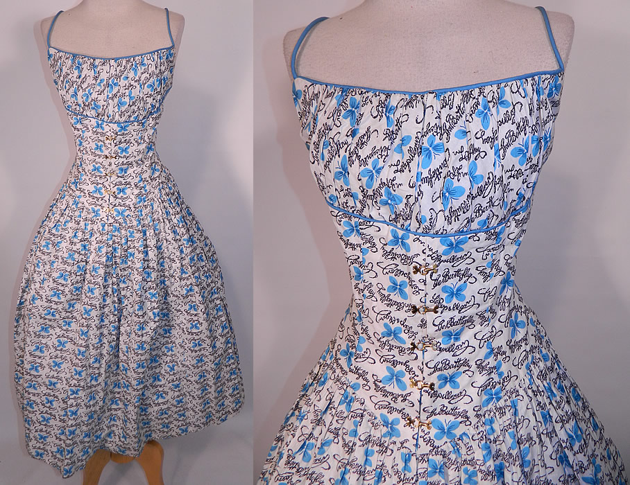 Vintage Blue Butterfly Papillon Print Cotton Circle Skirt Summer Sun Dress. This vintage blue butterfly papillon print cotton circle skirt summer sun dress dates from the 1950s. It is made of a white cotton fabric, with blue butterflies and  black hand writing  of the English word "Butterfly" & French "Papillon" novelty print designs.