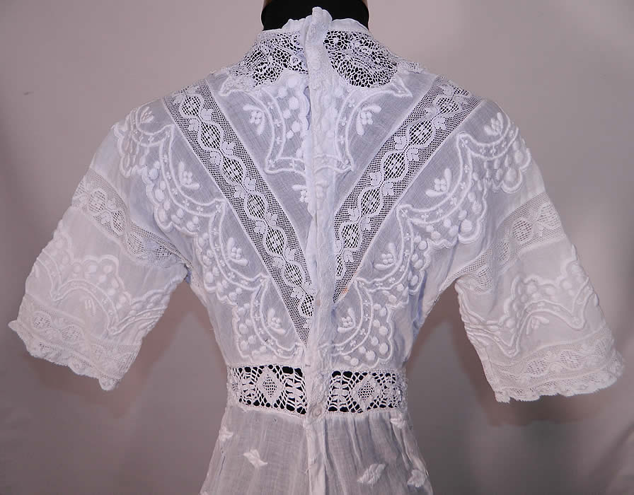 Edwardian  Embroidered White Cotton Batiste  Lace Graduation Wedding Dress.  The dress measures 50 inches long, with 34 inch hips, a 22 inch waist, 34 inch bust and 14 inch back. It is in good condition. This is truly a wonderful piece of antique textile lace art which could be worn as a wedding gown or graduation dress. 