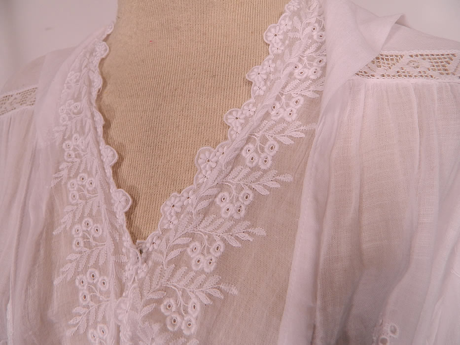 Edwardian Eyelet Embroidered White Cotton Batiste  Lace Graduation Wedding Dress. This lovely lace lawn dress is a long floor length, with a layered blouse style top, sailor collar with crochet ball trim hanging down the back, V front neckline, long sleeves, a fitted belted tie sash waist, front snaps for closure and  is sheer, unlined.