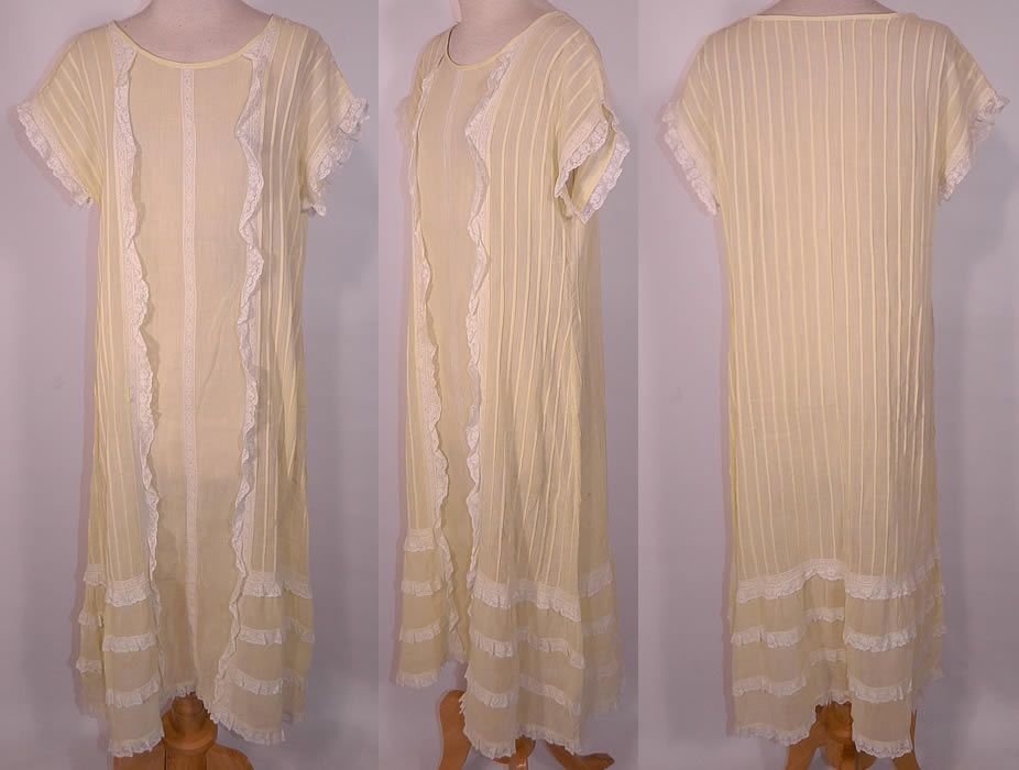 Vintage Pastel Yellow Cotton Pleated  Lace Ruffle Chemise Shift Dress. This vintage pastel yellow cotton pleated lace ruffle chemise shift dress dates from the 1920s.