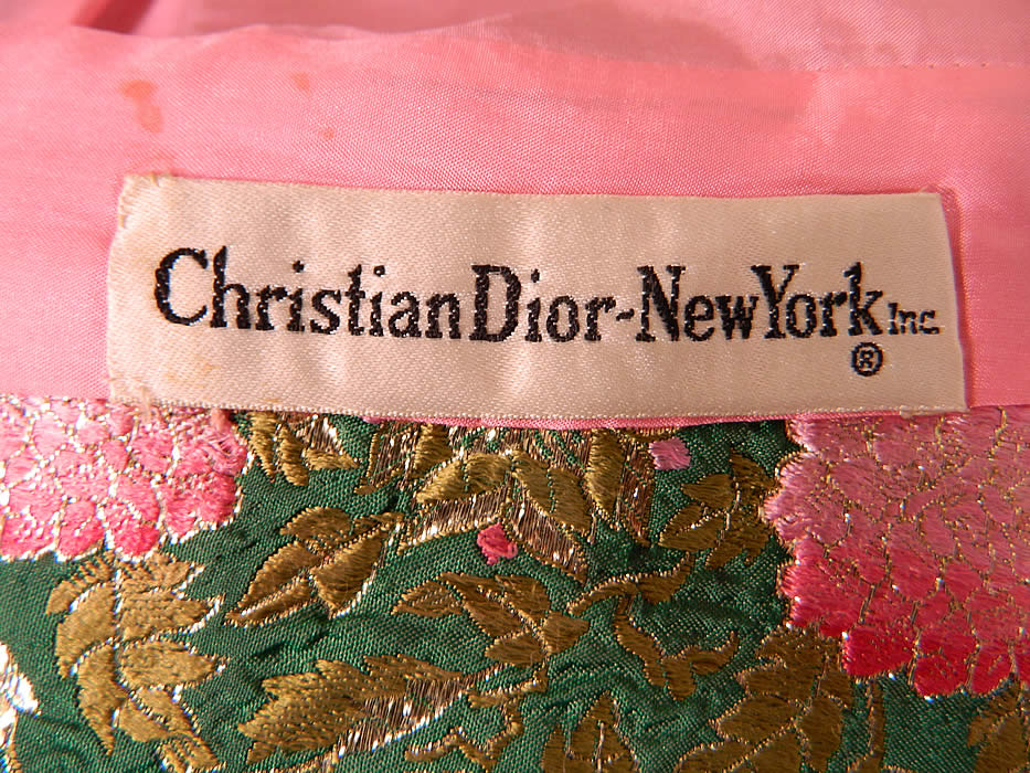 Vintage Christian Dior Floral Lame Lam&eacute; Suit Jacket Skirt & Pink Silk Blouse. There is a "Christian Dior-New York, Inc." designer label  sewn inside. The 3 piece outfit is in good condition, with only a few faint tiny age spot stains on the inside silk lining jacket and faint under arm discoloration, with a small mend repair on the back of the blouse. This is truly a wonderful piece of quality made  designer wearable art! 