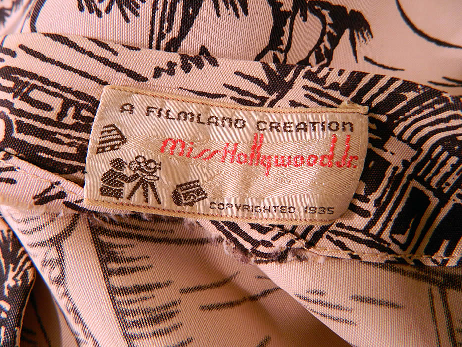 Vintage Miss Hollywood Jr Filmland Creation Western Novelty Print Rayon Dress Belted Suit. There is "A Filmland Creation Miss Hollywood Jr. Copyrighted 1935" label sewn inside the top.