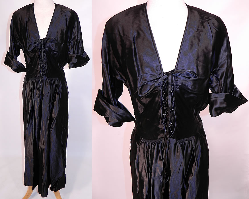 Vintage Black Silk Satin Corset Lace-up Front Neckline Evening Gown Dress. This vintage black satin corset lace-up front neckline evening gown dress dates from the 1940s. It is made of a luxurious heavy quality black satin fabric. This sexy evening gown dress has a plunging V front neckline with corset lacing, smocking detail on the front waist, a long full skirt with hidden side pockets, short sleeves with rolled cuffs, broad shoulder padding and side zipper closure.