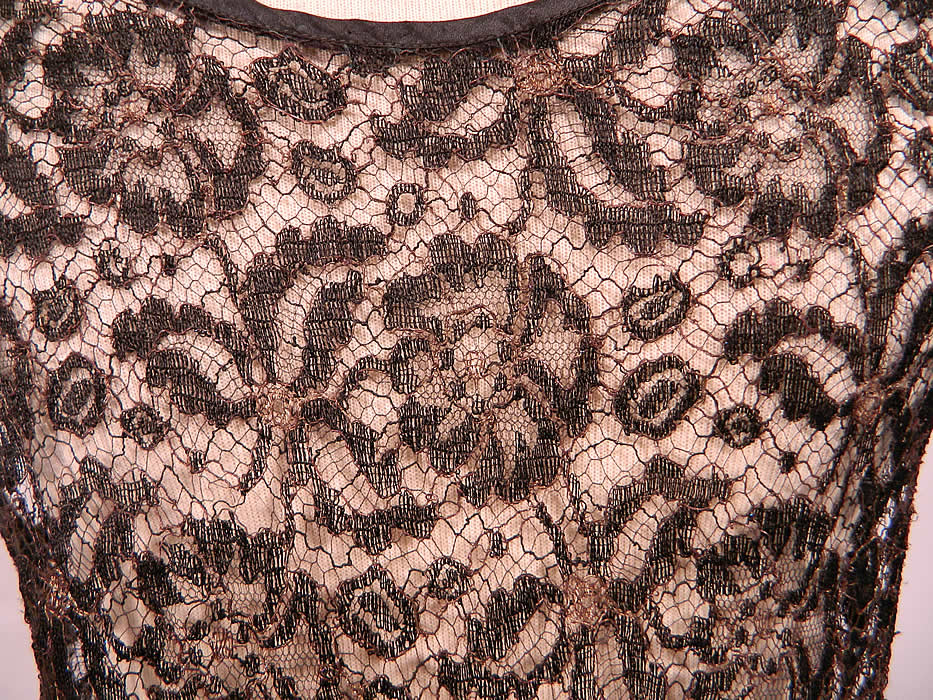 Art Deco Black Gold Lam&eacute; Lame Lace Handkerchief Skirt Drop Waist Dress. The dress measures 40 to 48 inches long, with 36 inch hips, a 26 inch waist and 34 inch bust. It is in good condition. This is truly a wonderful piece of Art Deco wearable textile art! 