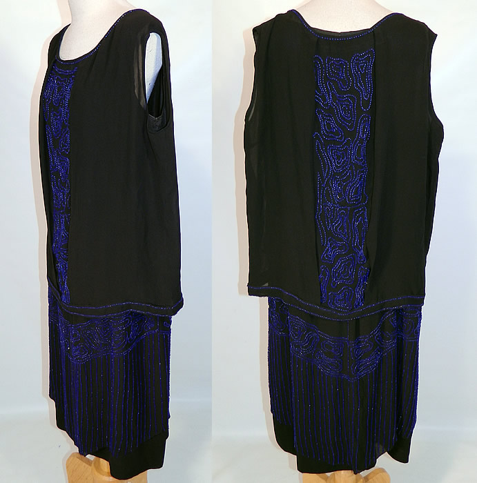 Vintage Art Deco Black Silk Cobalt Blue Beaded Drop Waist Flapper Dress. The dress measures 40 inches long, with 38 inch hips, a 36 inch waist and 36 inch bust. It is in good condition, with only a few loose missing beads. This is truly a wonderful piece of Art Deco wearable beaded textile art! 
