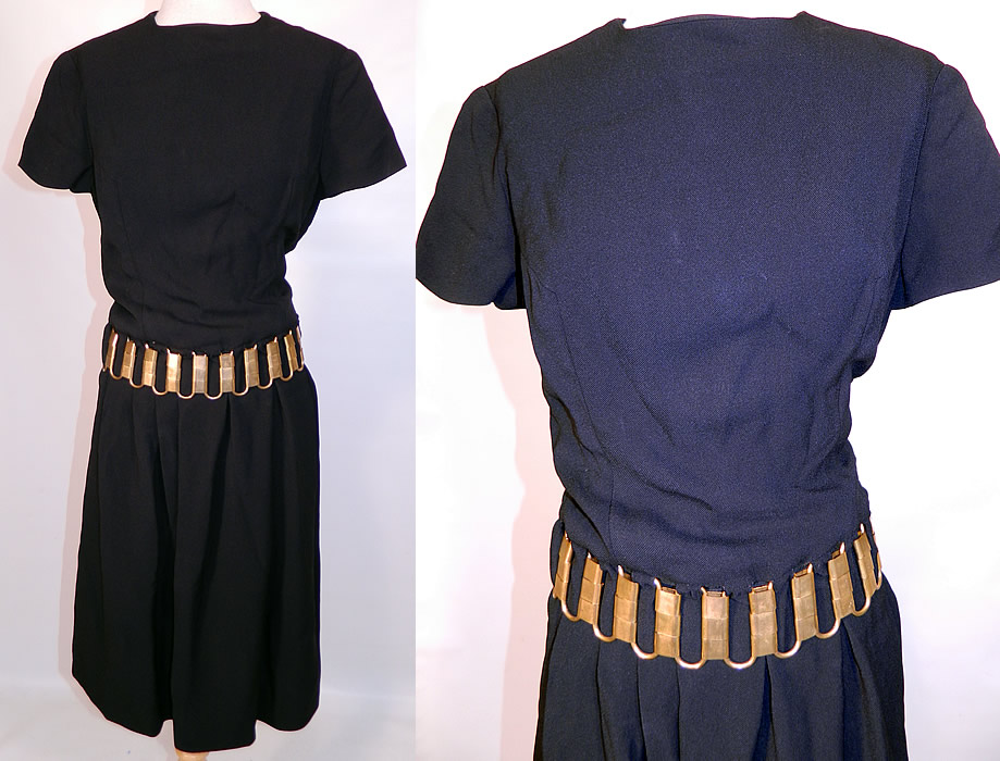 Vintage Christian Dior Paris Gold Chain Link Belted Black Cocktail Dress. This amazing vintage Christian Dior Paris gold chain link belted black cocktail dress dates from the 1960s. 