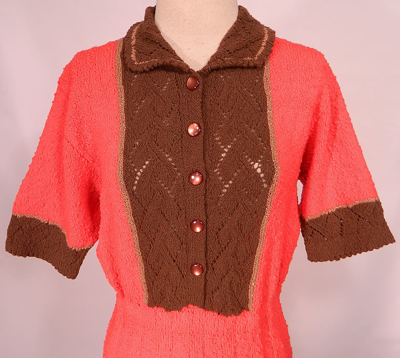 Vintage Coral & Brown Hand Knit Crochet Wool Pleated Skirt Dress. This fabulous form fitting knit dress has a sheer weave brown bib front button down neckline, with fold over collar, 3/4 length sleeves, a pleated skirt and is unlined. 