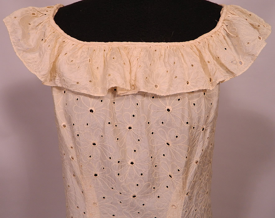 Vintage Eyelet Cream Silk Hawaiian Muumuu Wedding Gown Dress Train Skirt. This traditional Hawaiian muumuu style beach bridal wedding gown dress is loose fitting, a long floor length, with a off the shoulder ruffle flounce collar, rounded scoop neckline, ruffle trim hemline with long back train skirt and loop for holding it up, a back zipper closure and is sheer, unlined. 