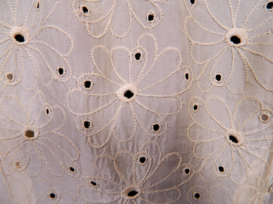 Vintage Eyelet Cream Silk Hawaiian Muumuu Wedding Gown Dress Train Skirt. The dress measures 52 inches long in the front, 106 inches long in the back, with 38 inch hips, a 28 inch waist and 38 inch bust.