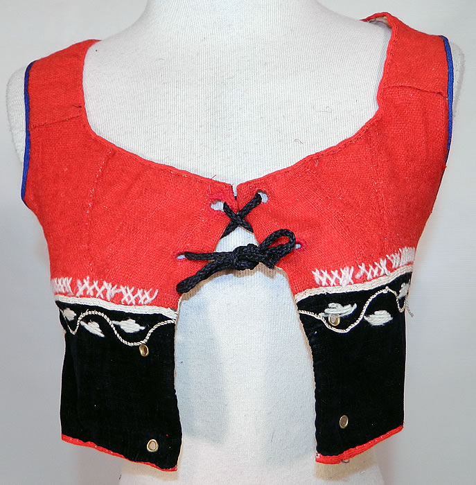 Vintage Portugese Folk Costume Embroidered Wool Vest Top. It is hand stitched, made of a woven red wool and black velvet fabric, with colorful decorative wool stitching hand embroidery work. 
